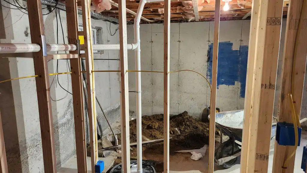 Basement bathroom rough-in wiring with new electrical boxes in the framing