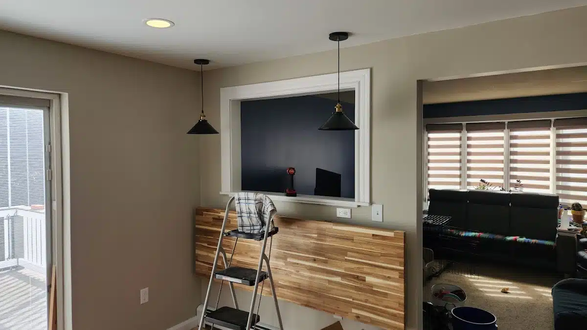 Black pendant lights and recessed lighting installed by Electric Wizard